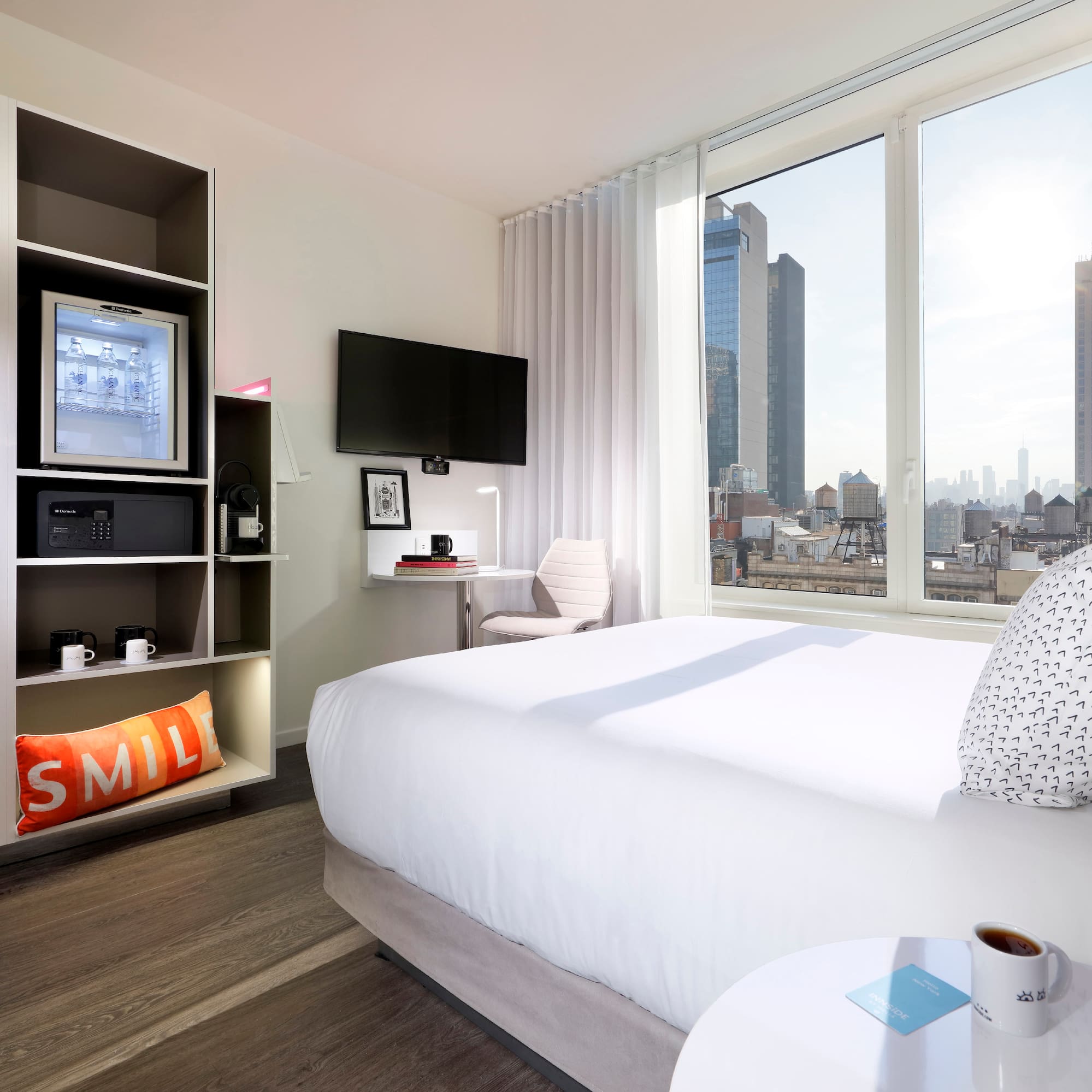 a room with a bed and a tv