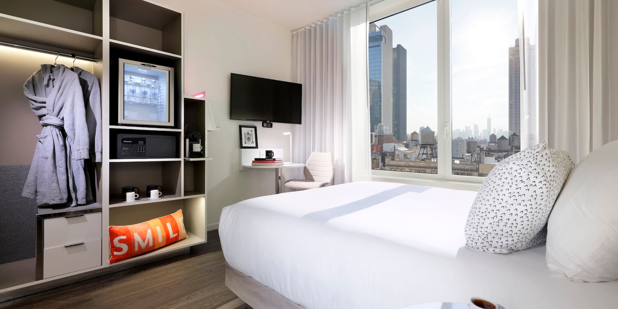 a room with a bed and a tv