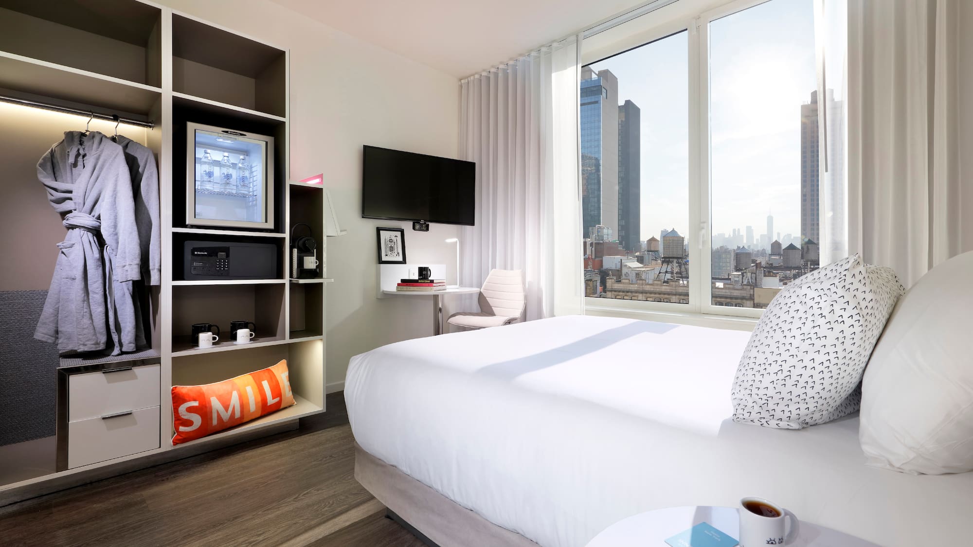 a room with a bed and a tv