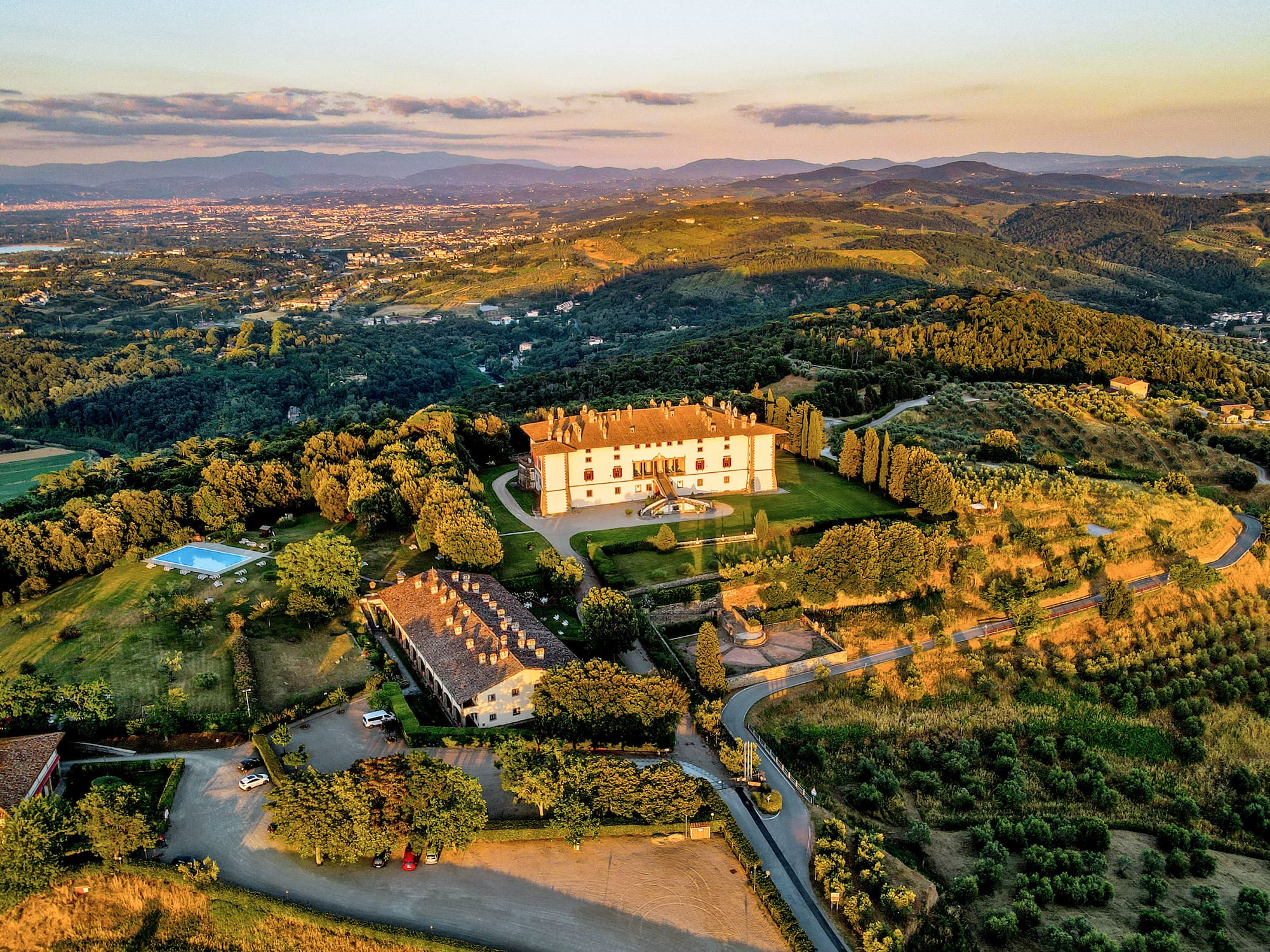 a large house surrounded by trees