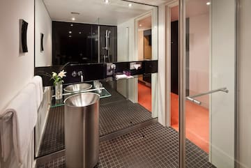 a bathroom with a glass shower door