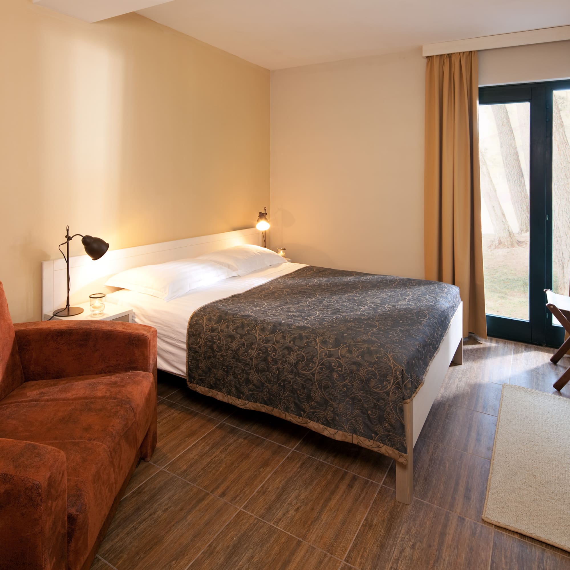 a bedroom with a bed and a chair