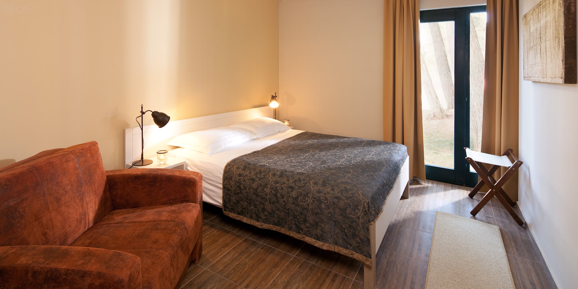 a bedroom with a bed and a chair