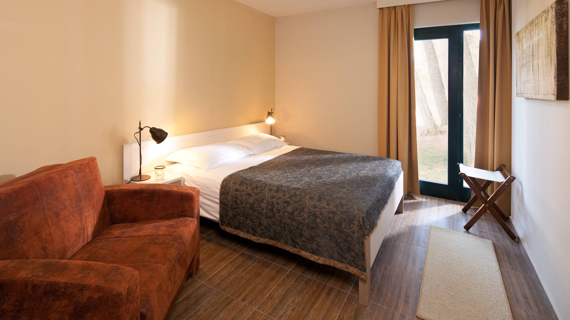 a bedroom with a bed and a chair