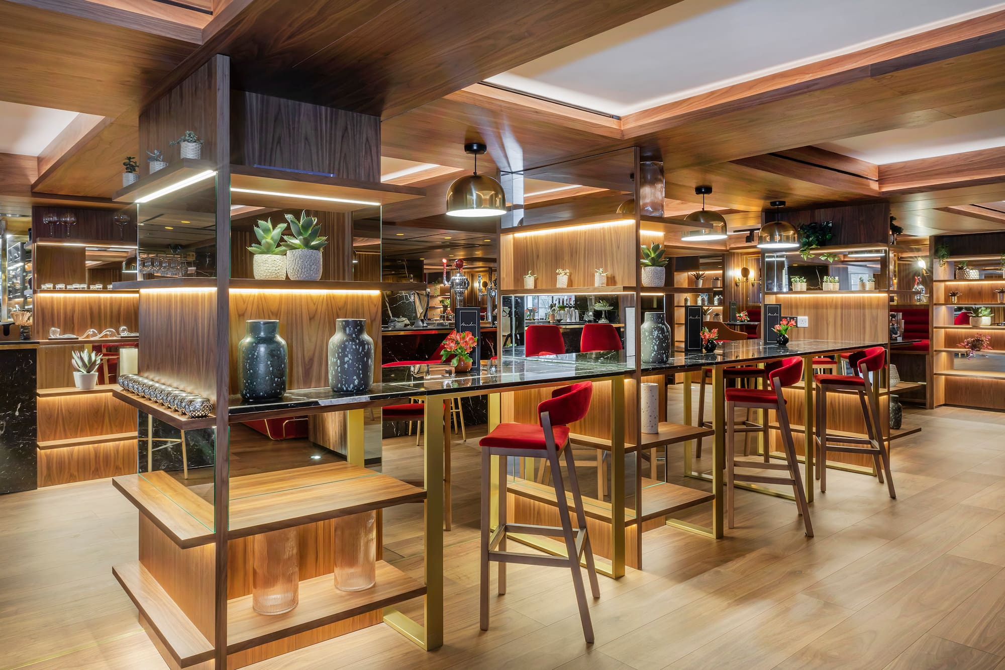 a room with a bar and chairs