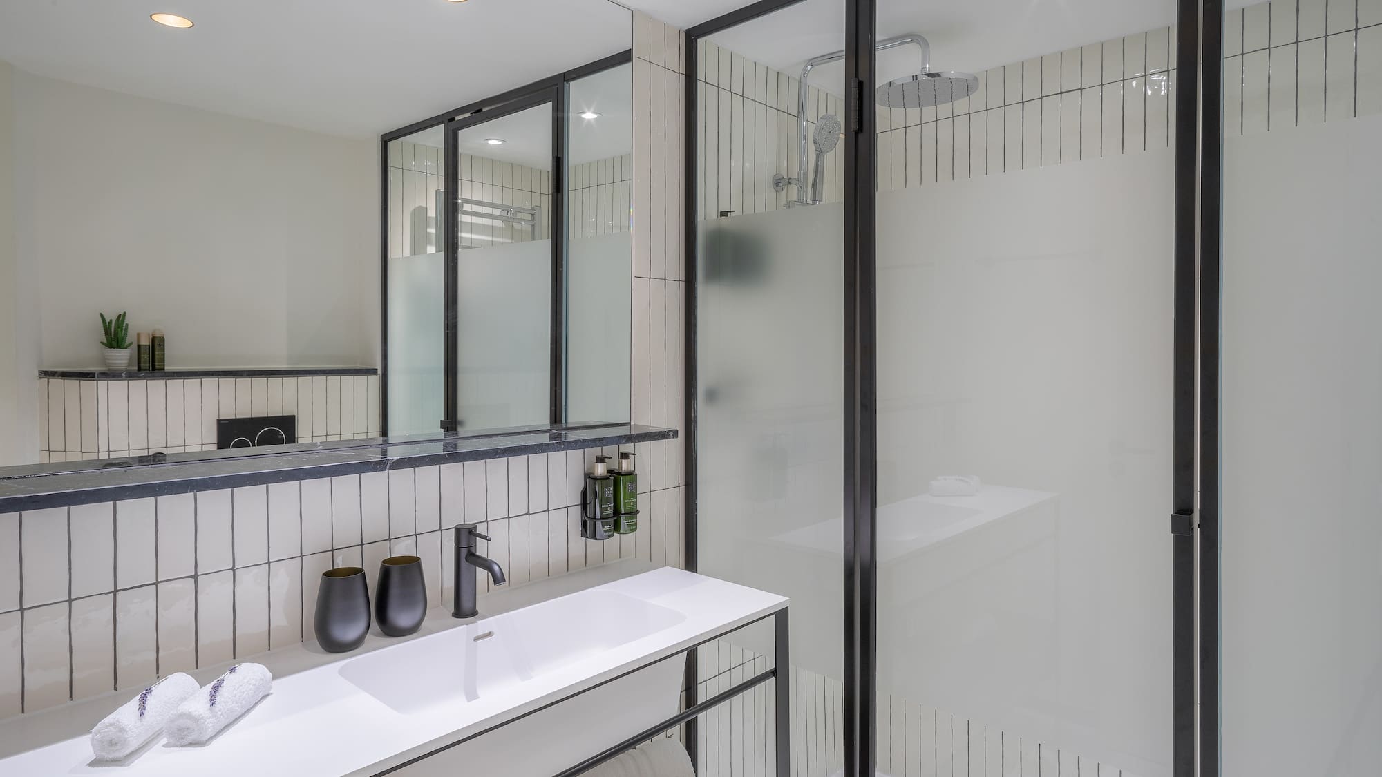 a bathroom with a shower and sink