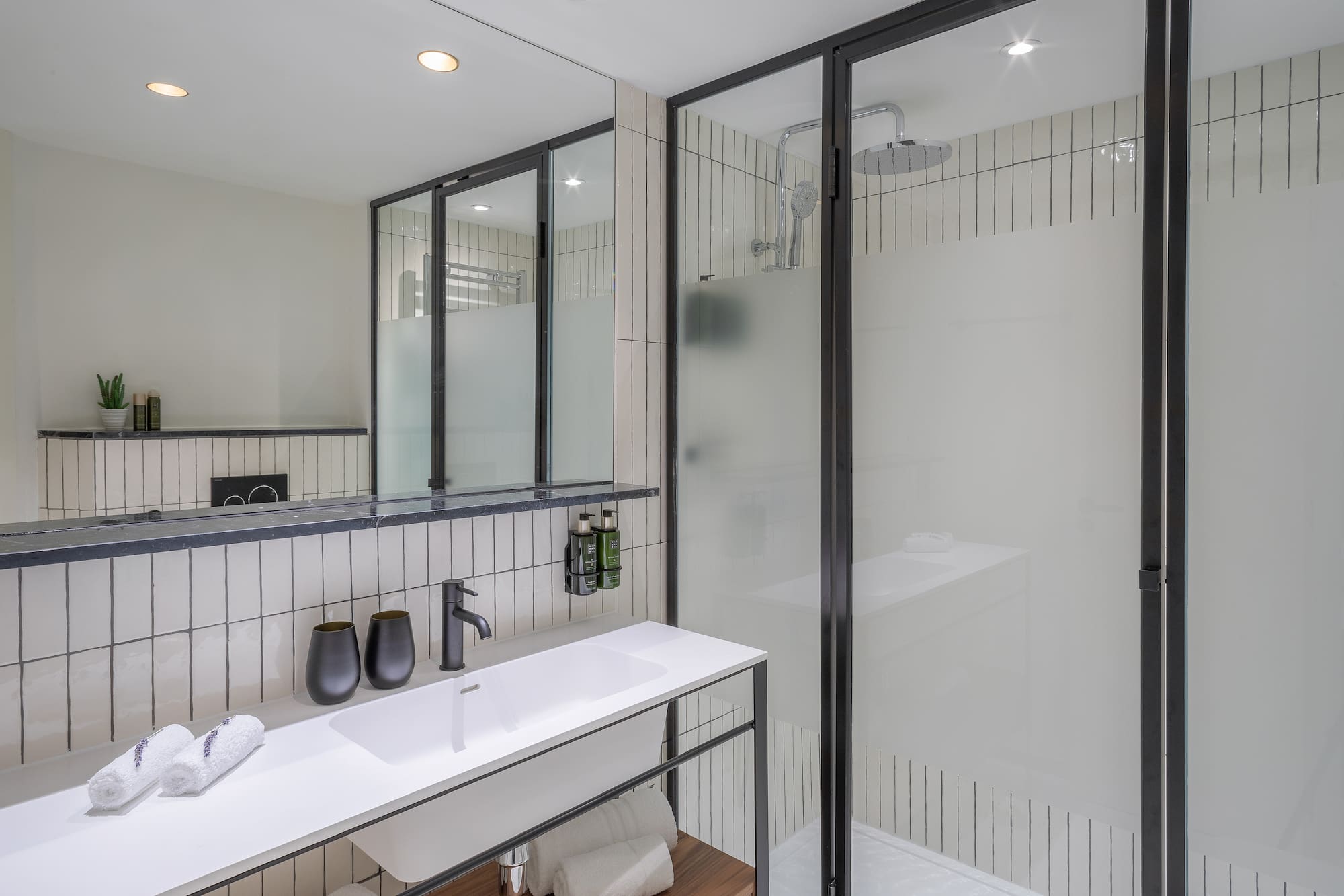 a bathroom with a shower and sink