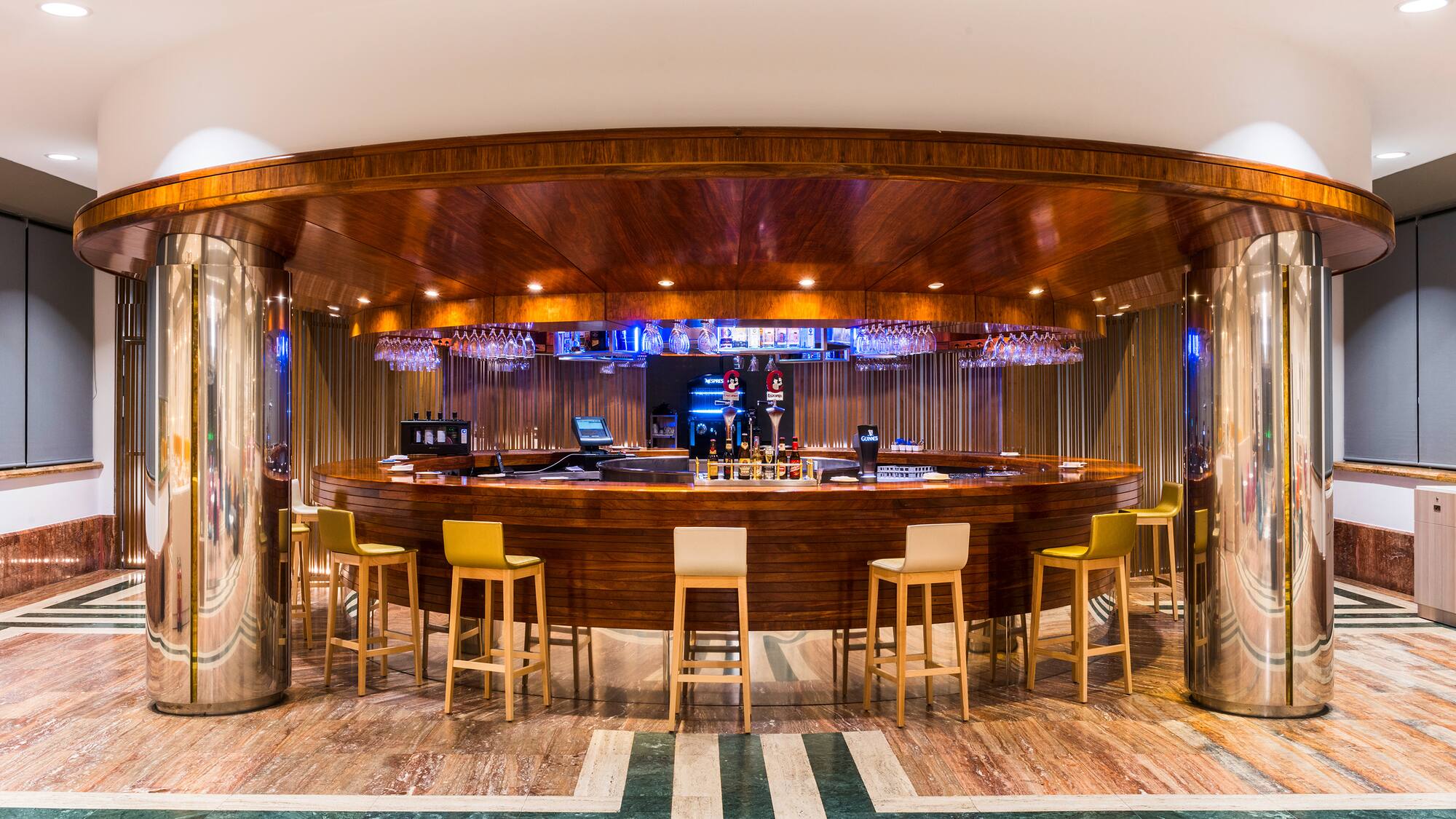 a bar with chairs and a table