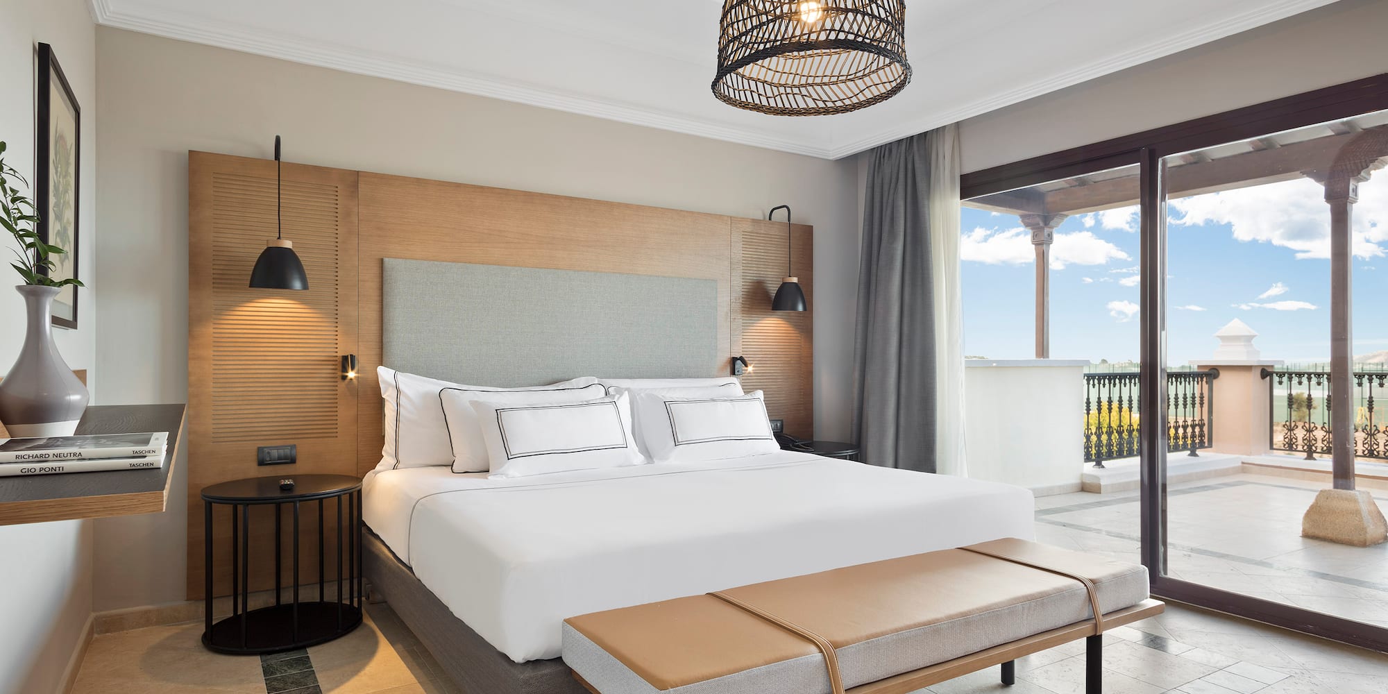 a bedroom with a bed and a bench