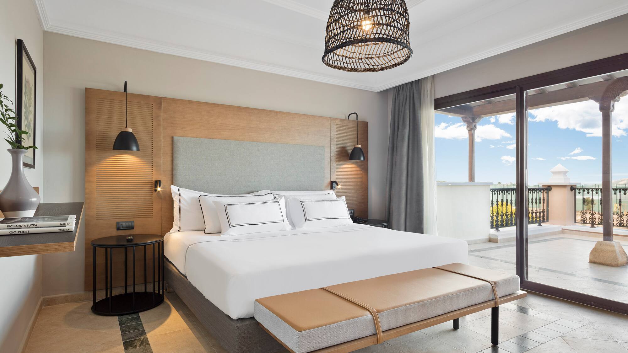 a bedroom with a bed and a bench