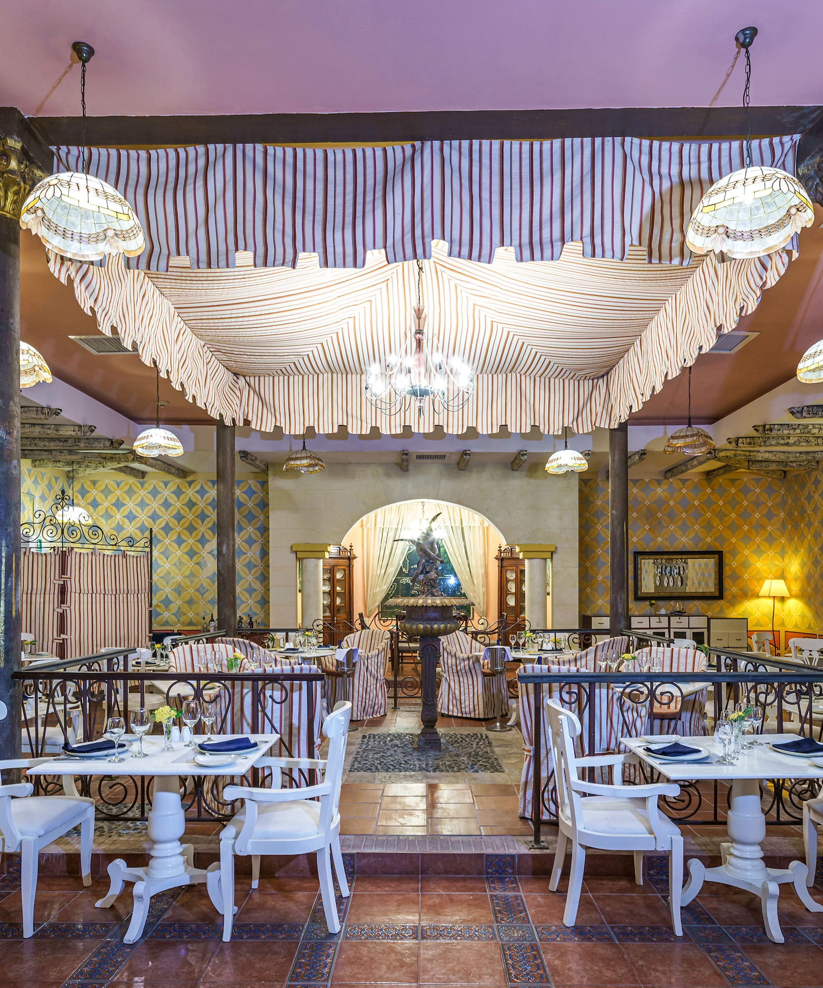 a restaurant with tables and chairs