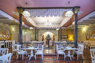 a restaurant with tables and chairs