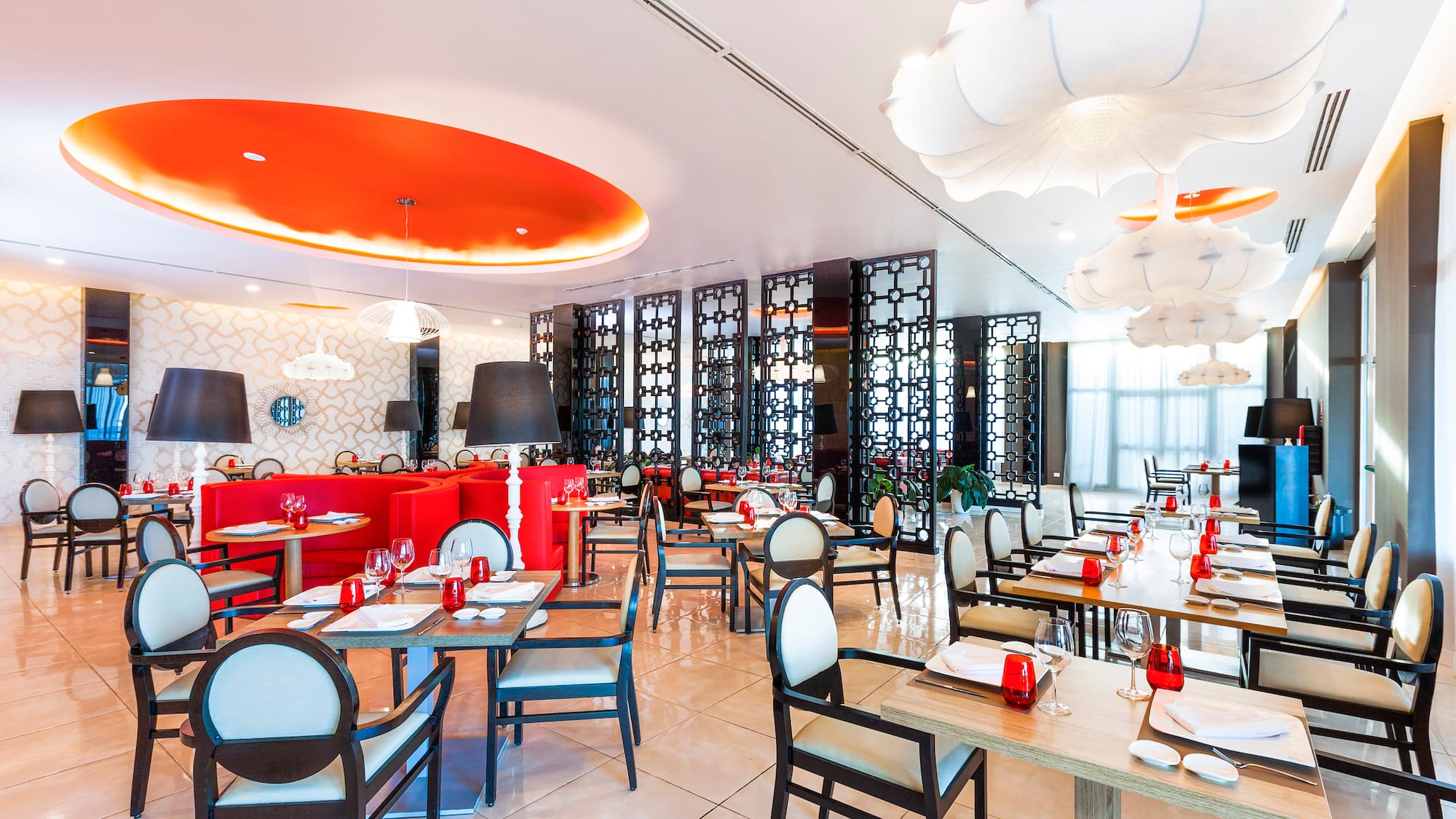 a restaurant with tables and chairs