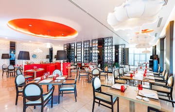 a restaurant with tables and chairs