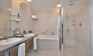 a bathroom with a shower and sink
