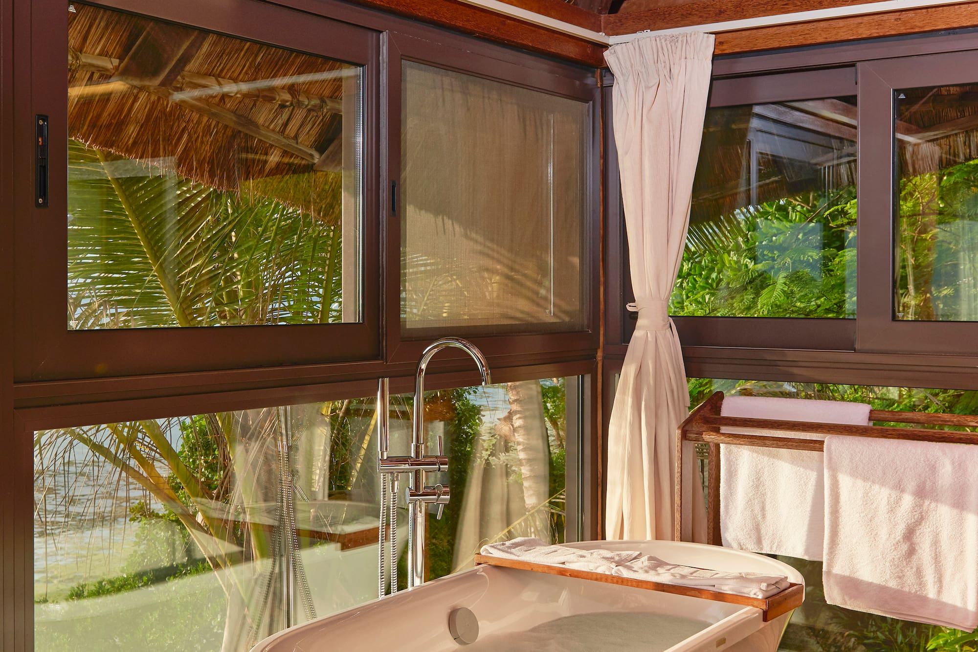 a bathroom with a tub and a shower