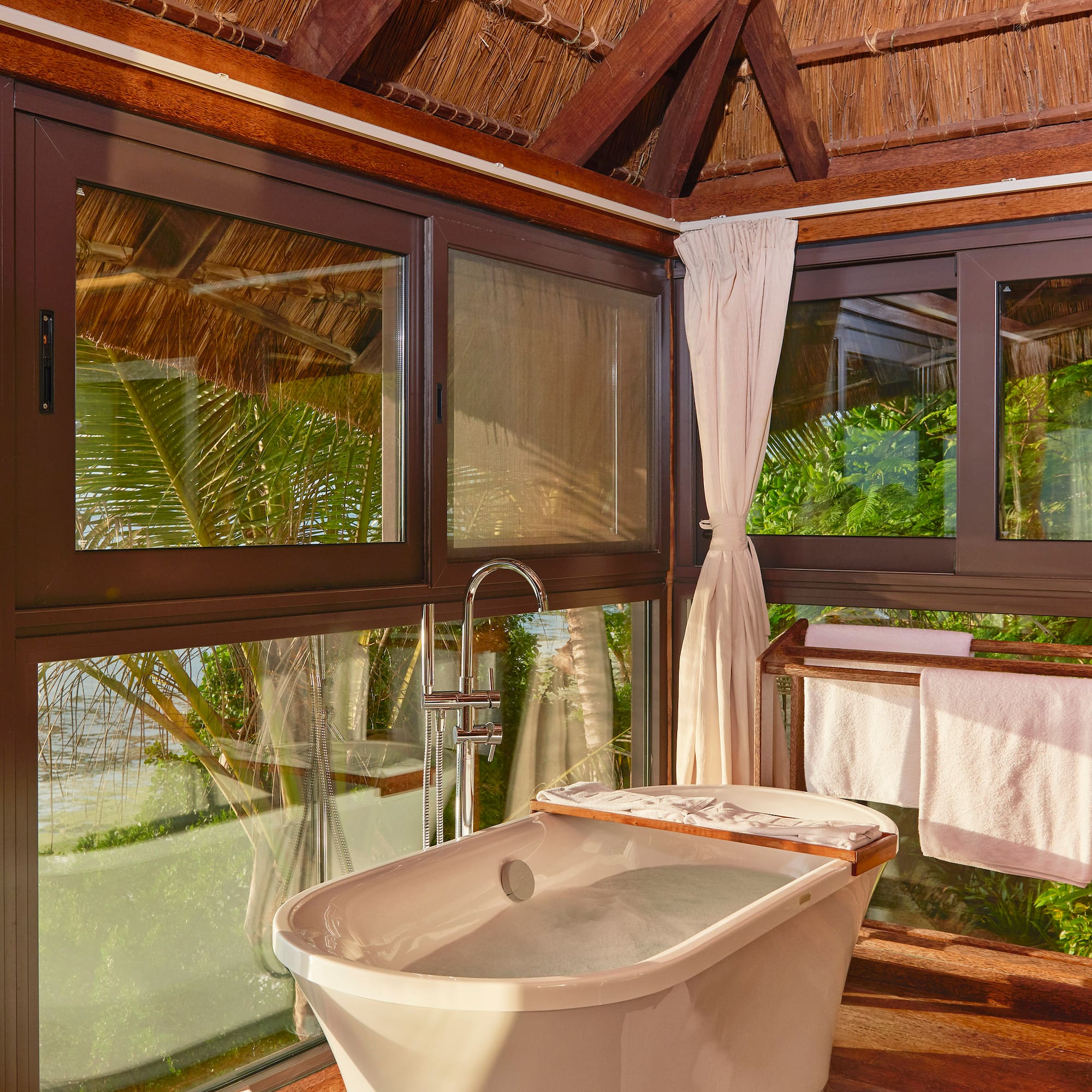 a bathroom with a tub and a shower