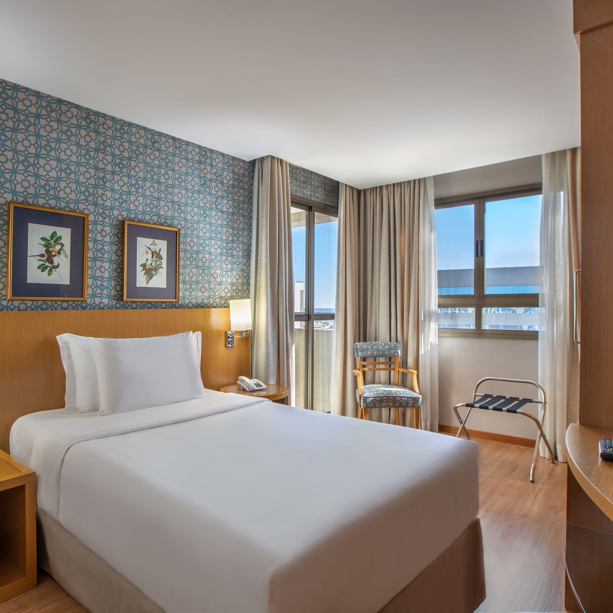 a hotel room with a bed and a table