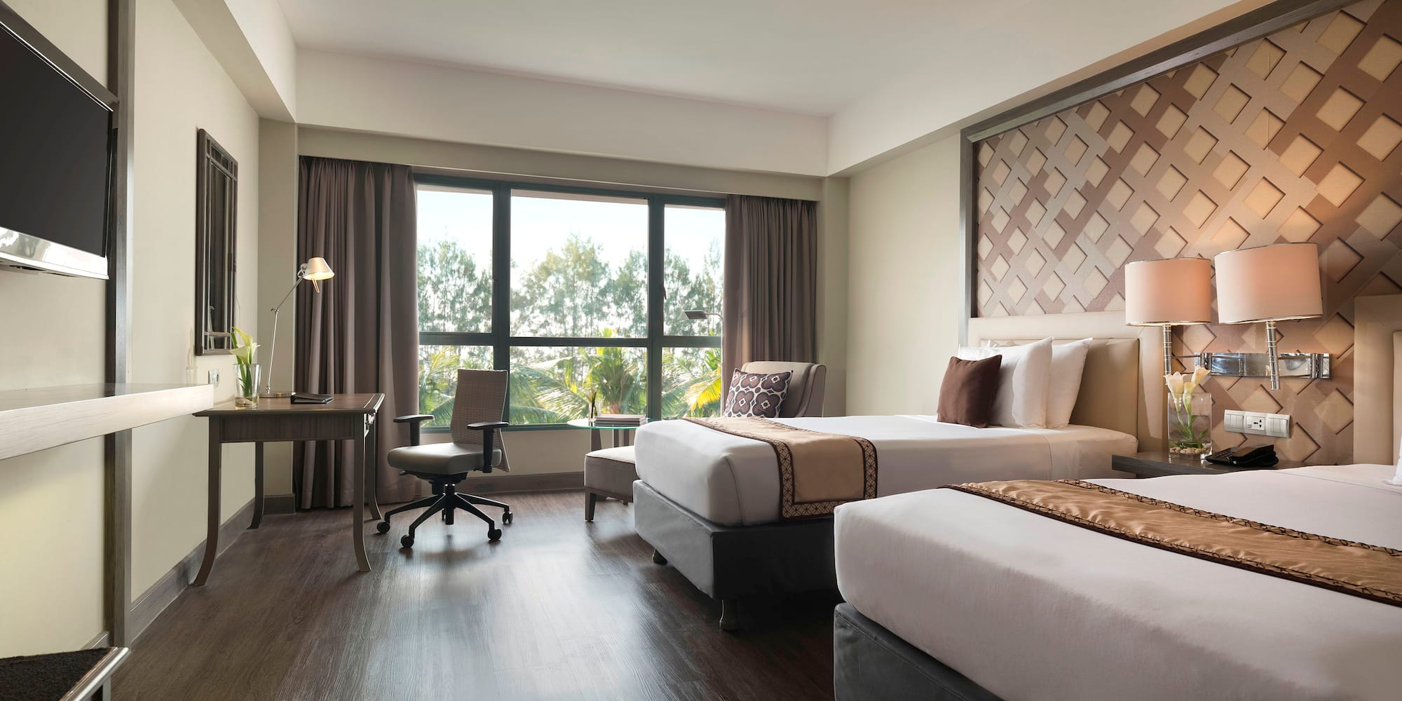 a room with two beds and a desk