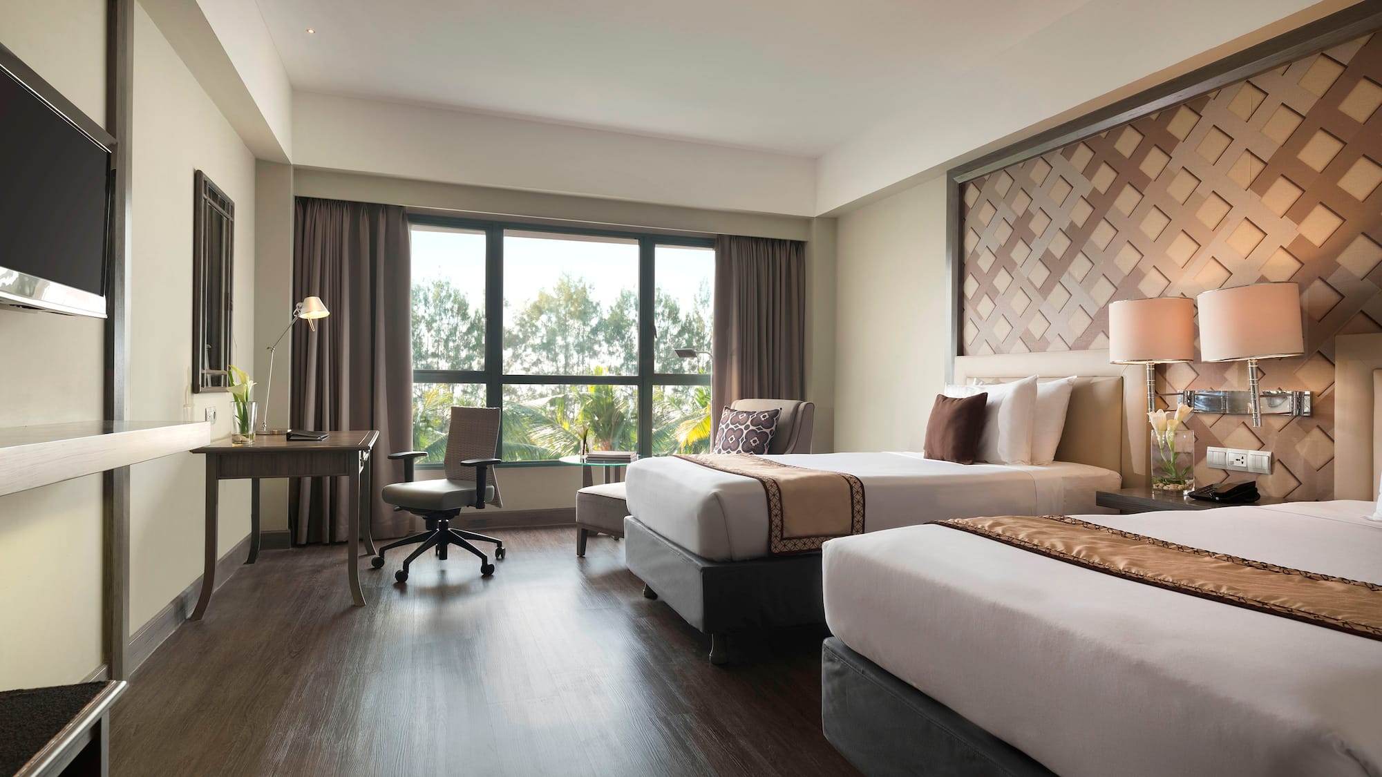 a room with two beds and a desk