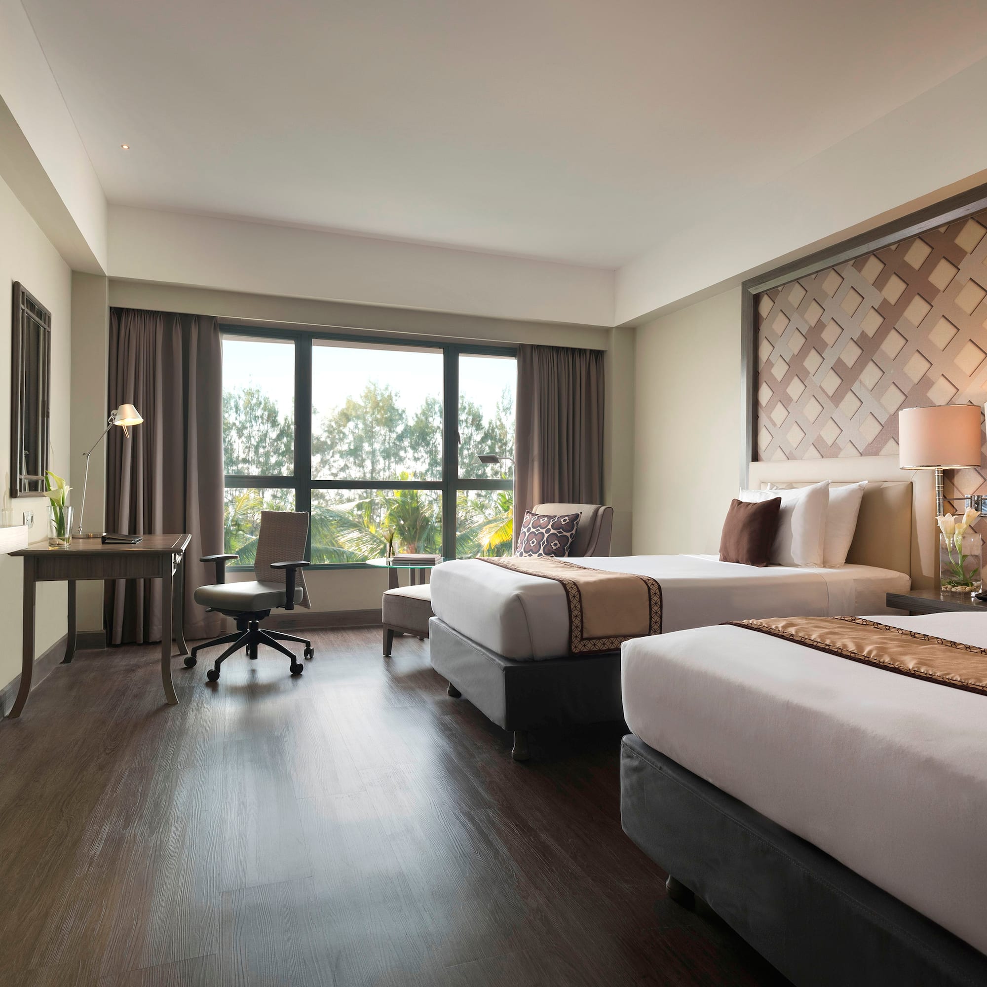 a room with two beds and a desk