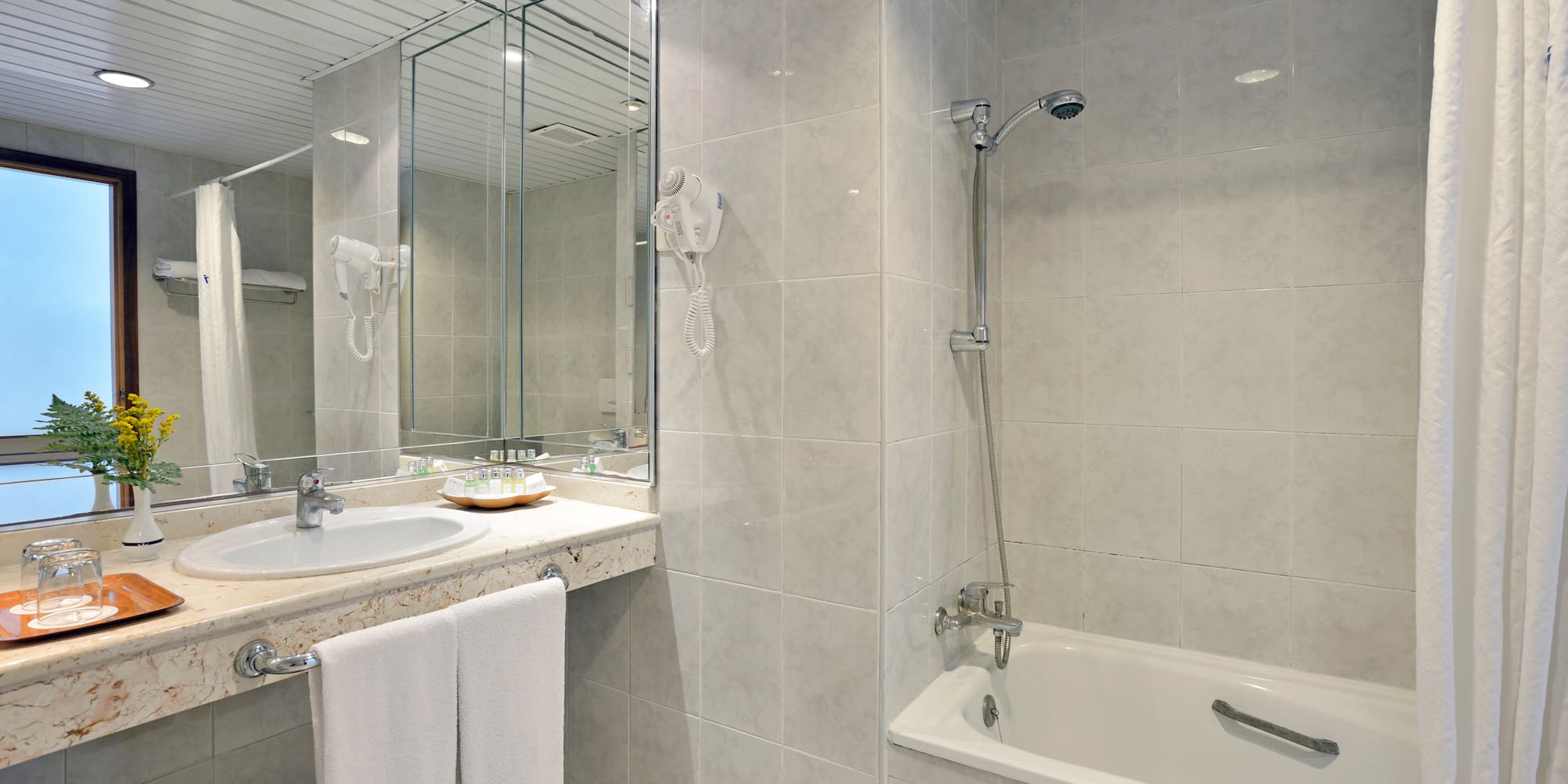 a bathroom with a sink and a bathtub