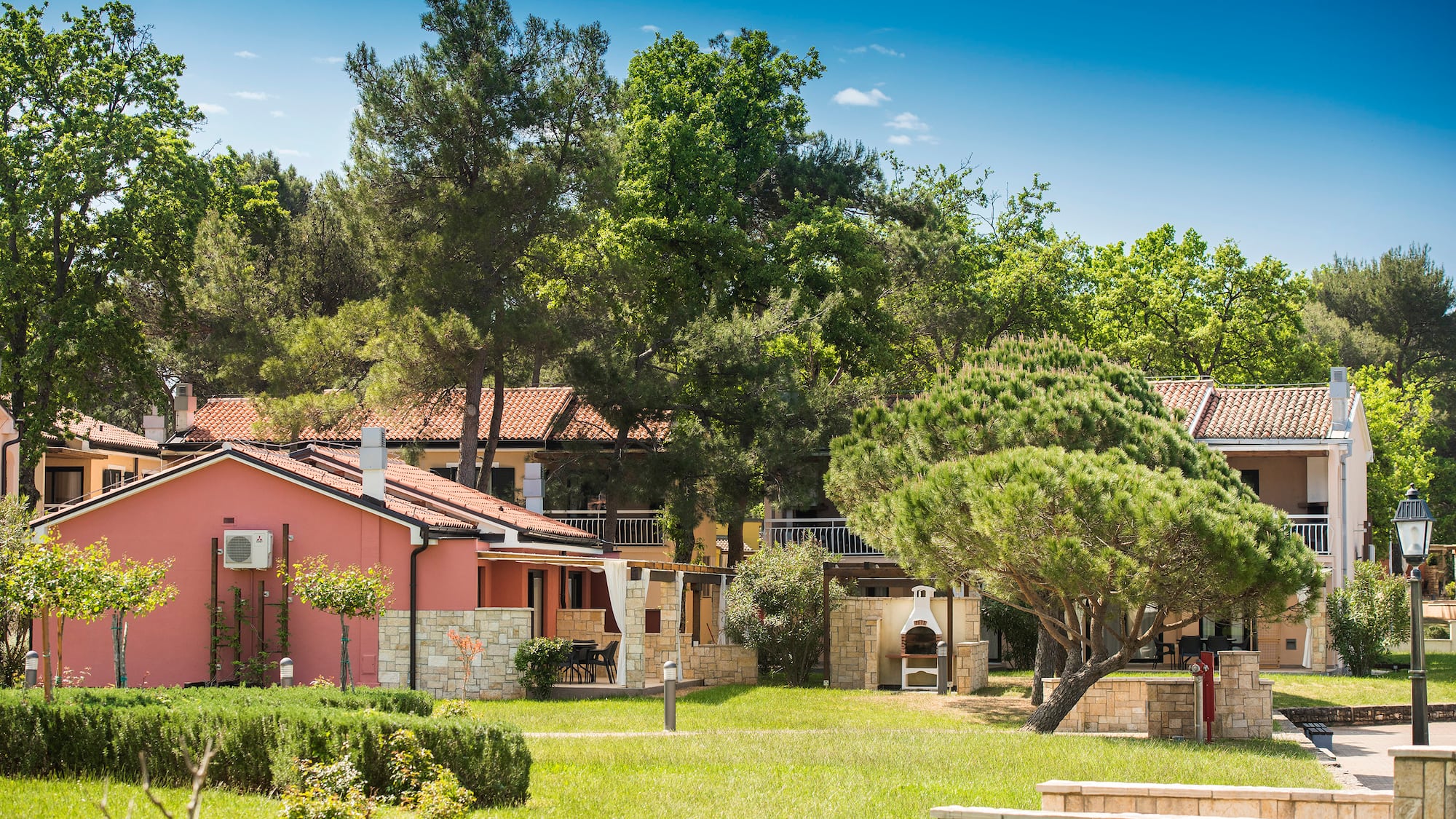 a house with trees and grass