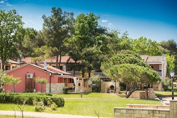 a house with trees and grass