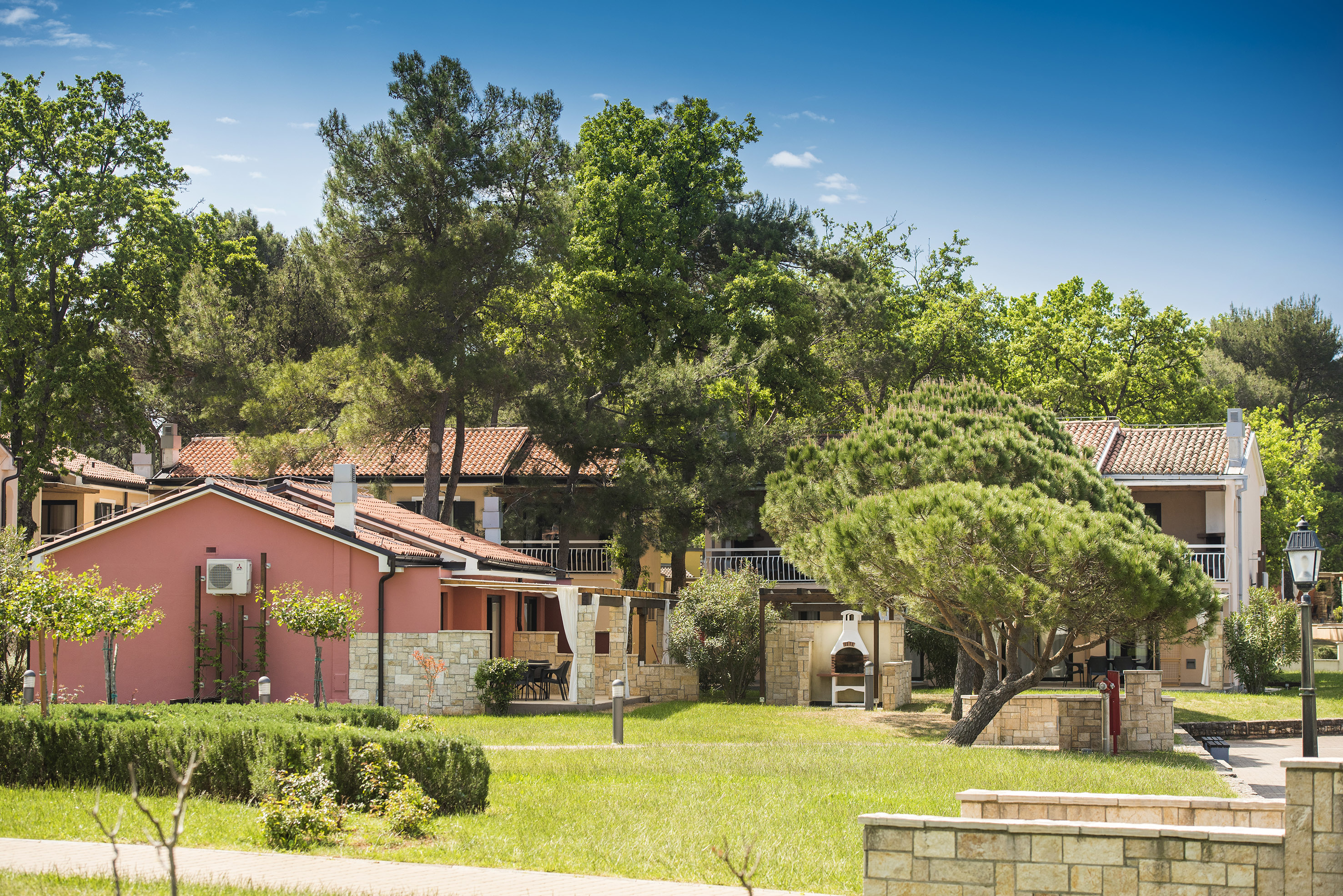 a house with trees and grass