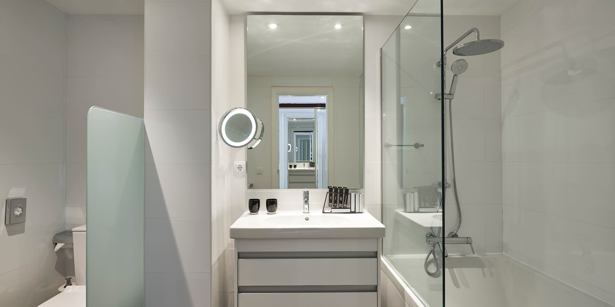 a bathroom with a mirror and a bathtub