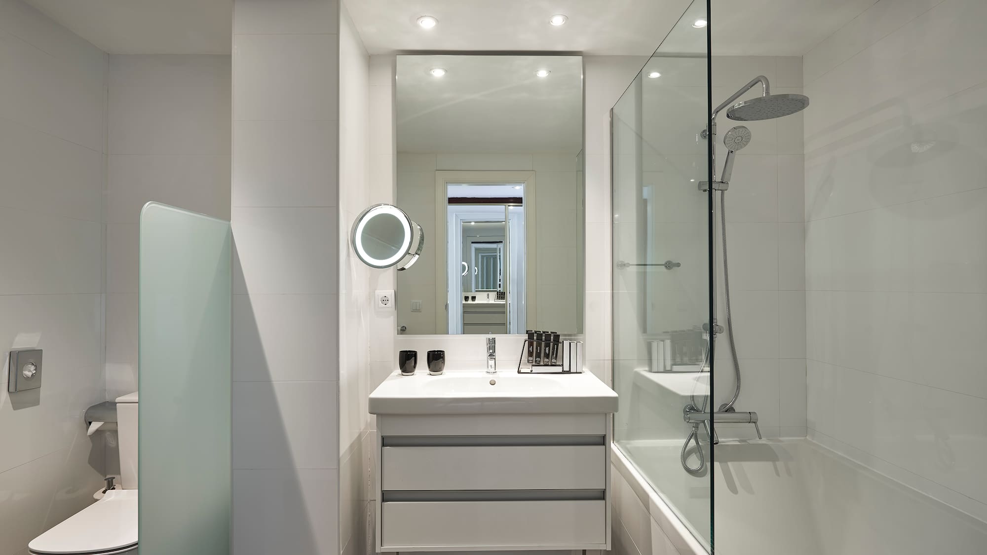 a bathroom with a mirror and a bathtub