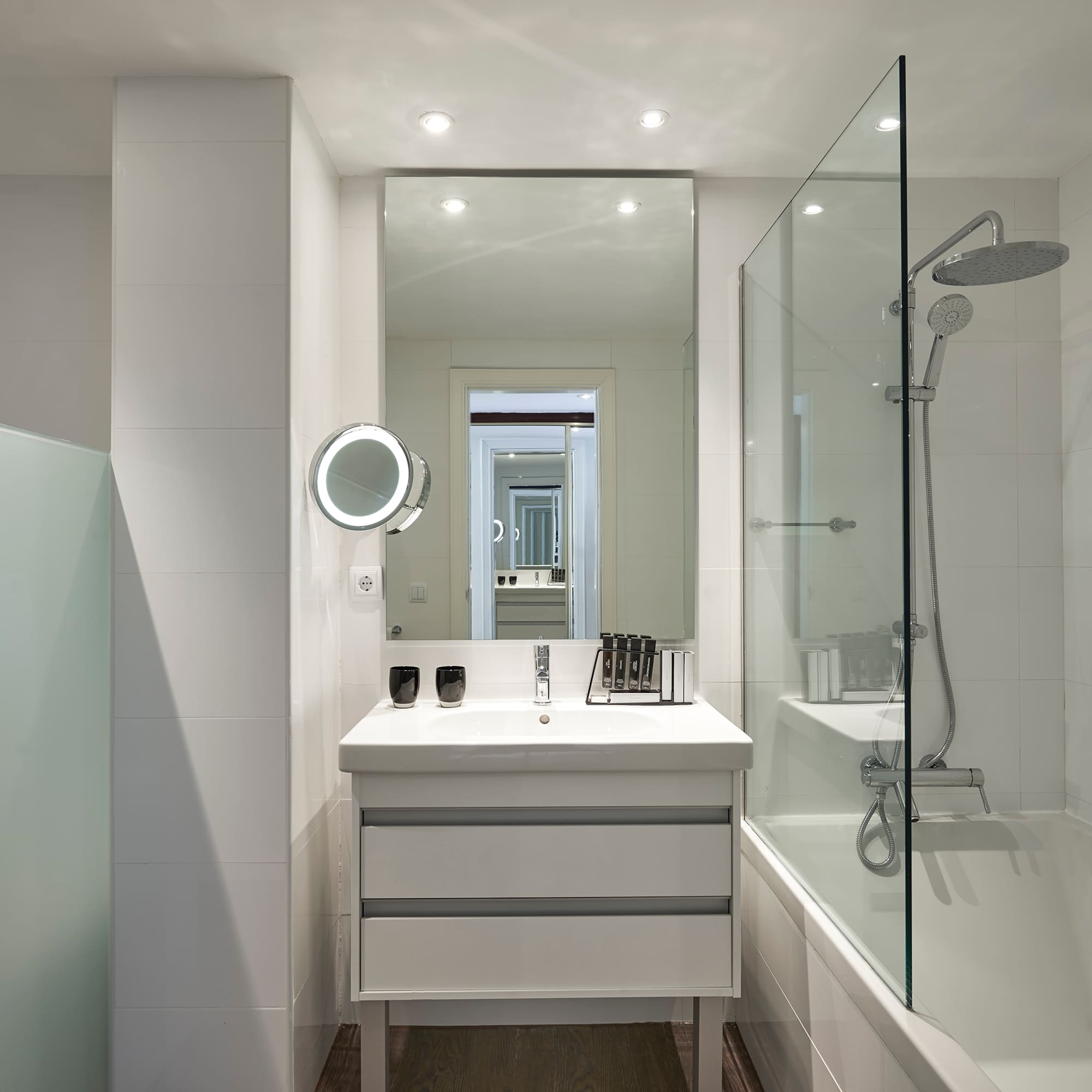 a bathroom with a mirror and a bathtub