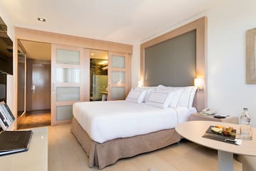 a bedroom with a bed and a table