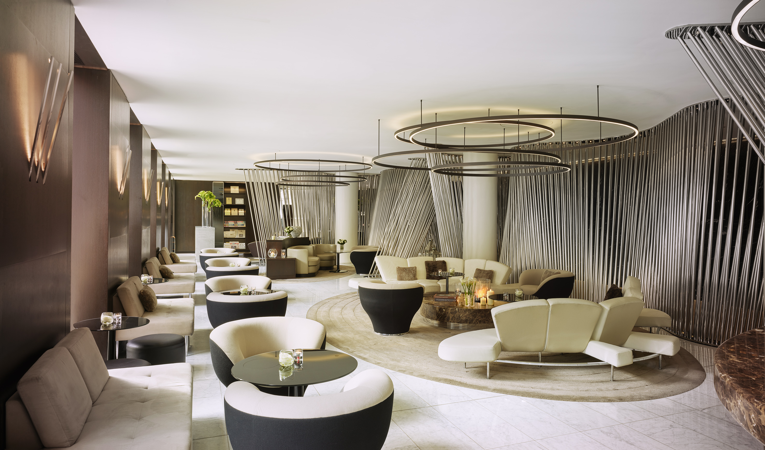 a room with a large round table and chairs