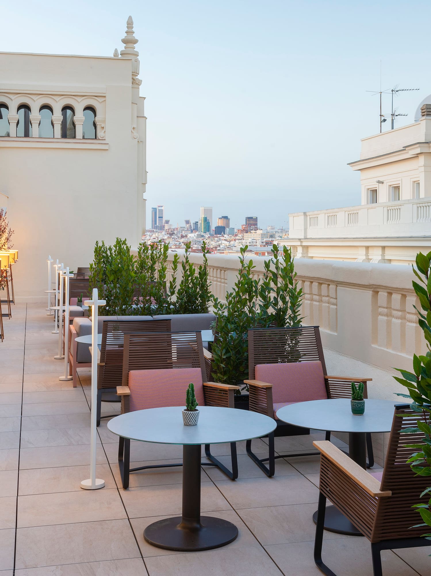 a patio with tables and chairs
