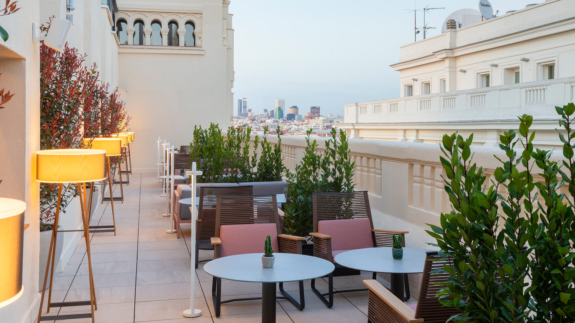a patio with tables and chairs