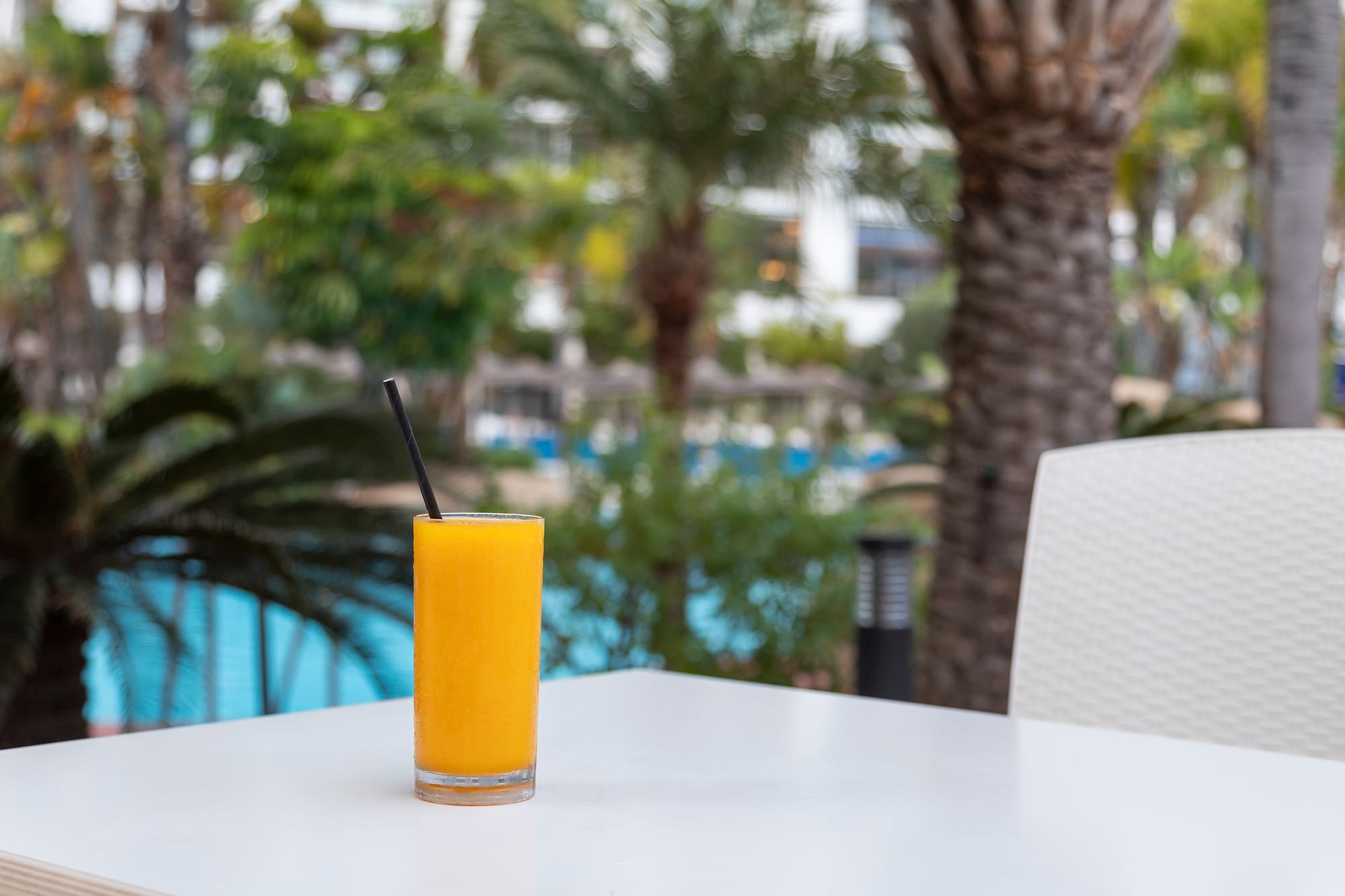 a glass of orange juice on a table