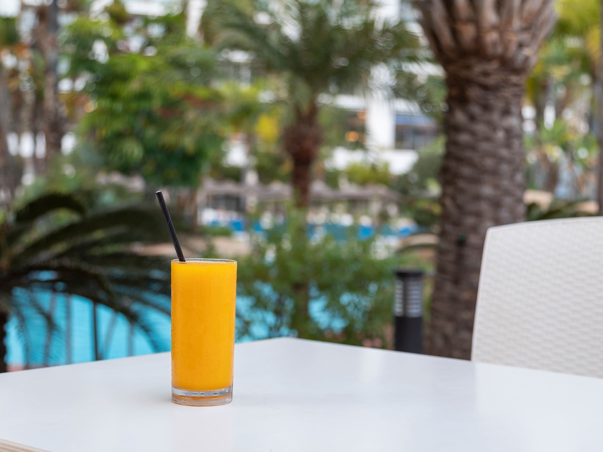 a glass of orange juice on a table