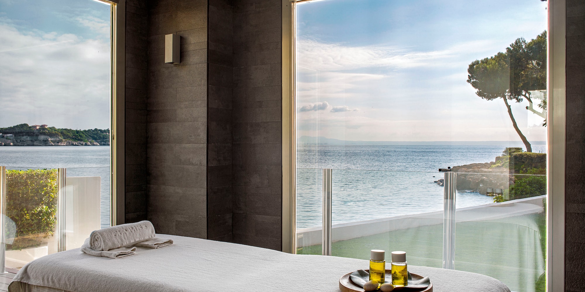 a massage table with a tray of oil on it