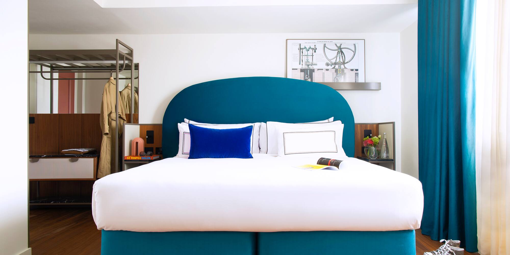 a bed with a blue headboard