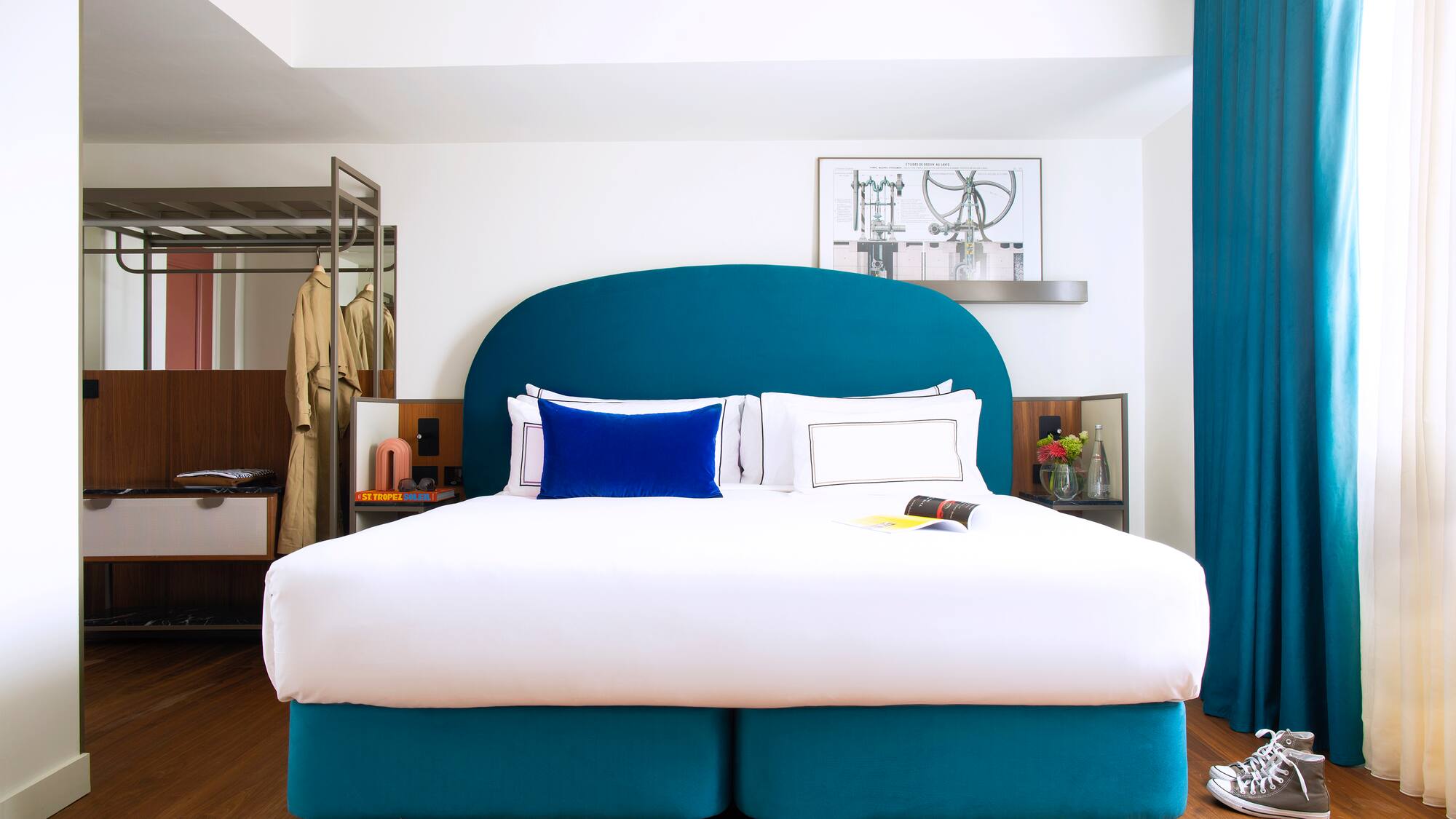 a bed with a blue headboard