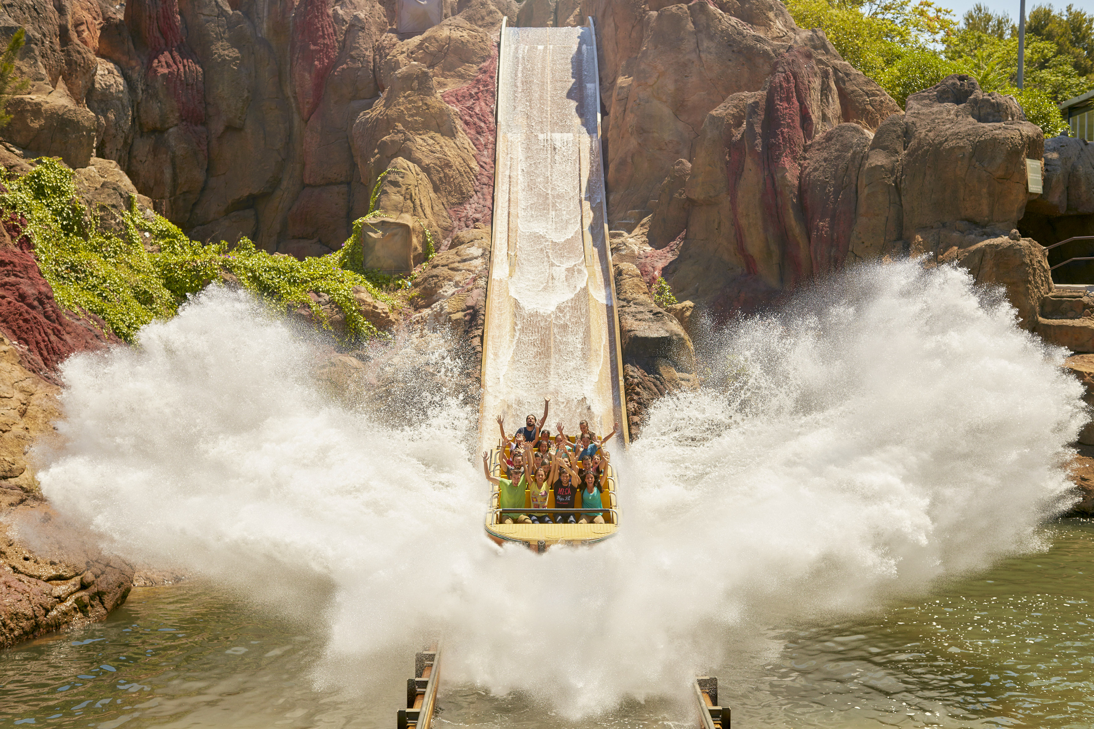 a group of people on a water slide