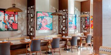 a restaurant with tables and chairs