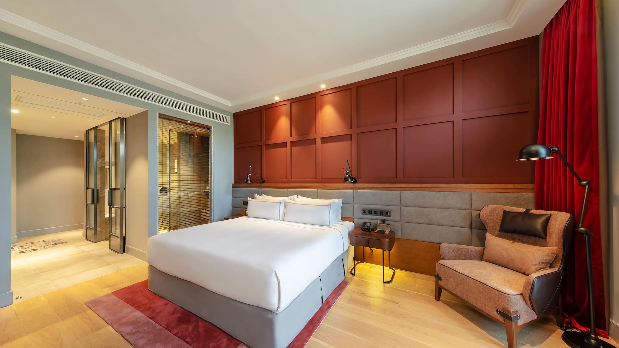 a bedroom with a bed and a chair