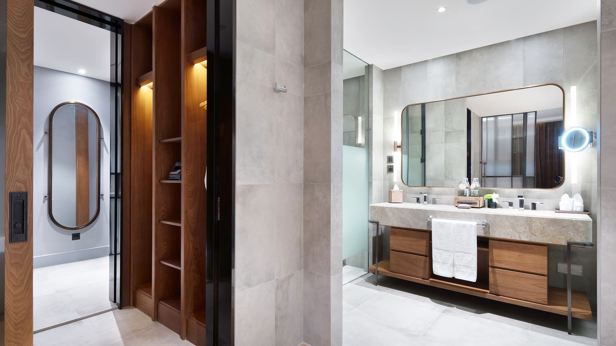 a bathroom with a mirror and shelves