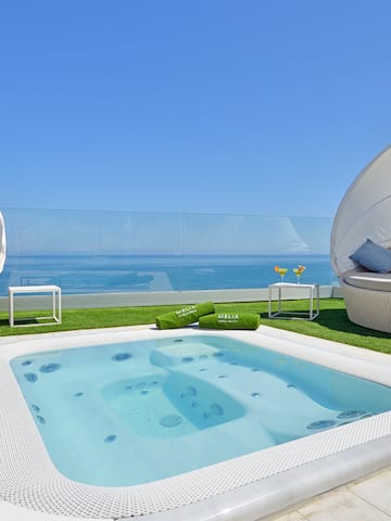 a hot tub with a white cover on the ground
