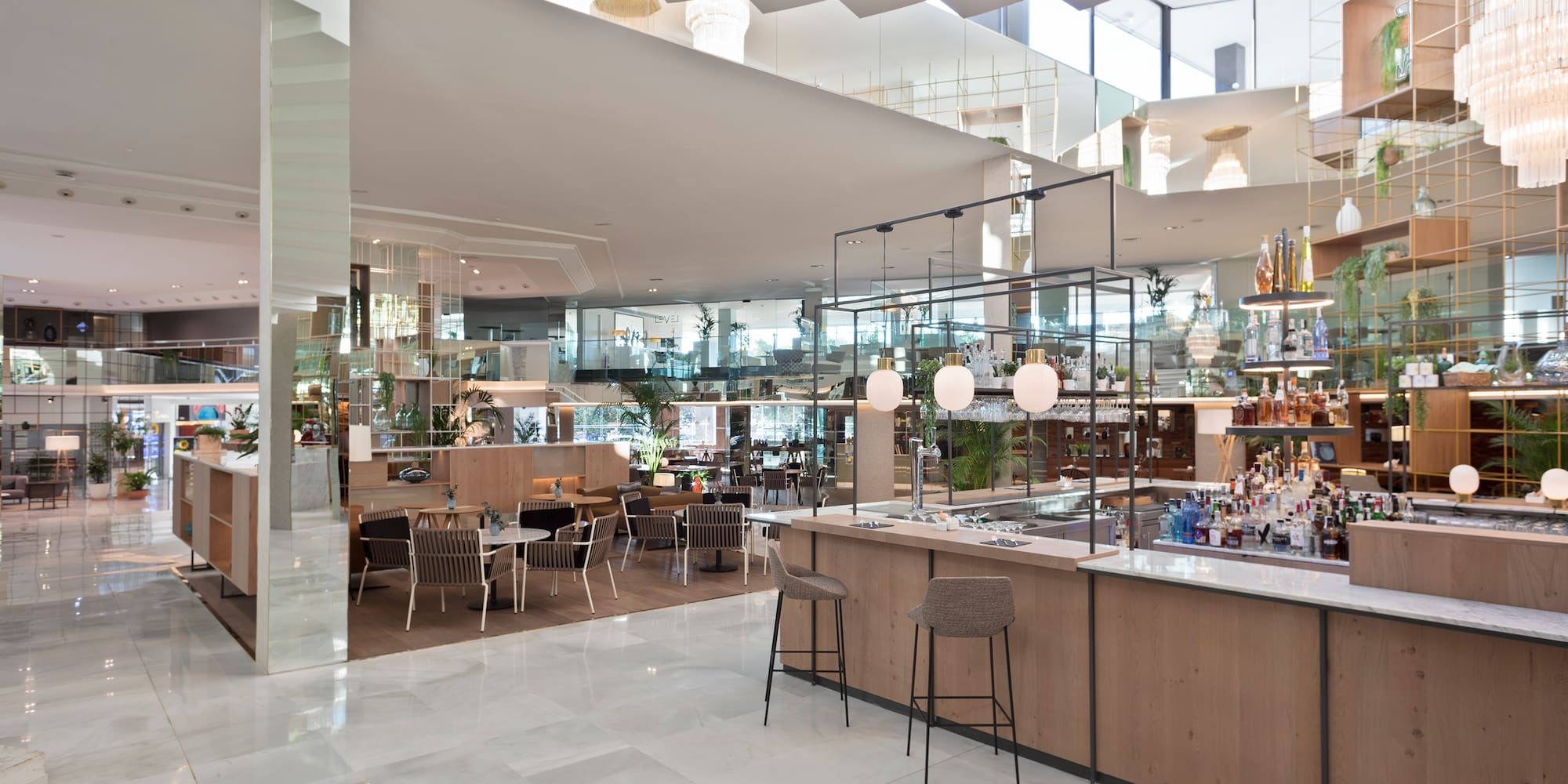 a restaurant with a bar and chairs