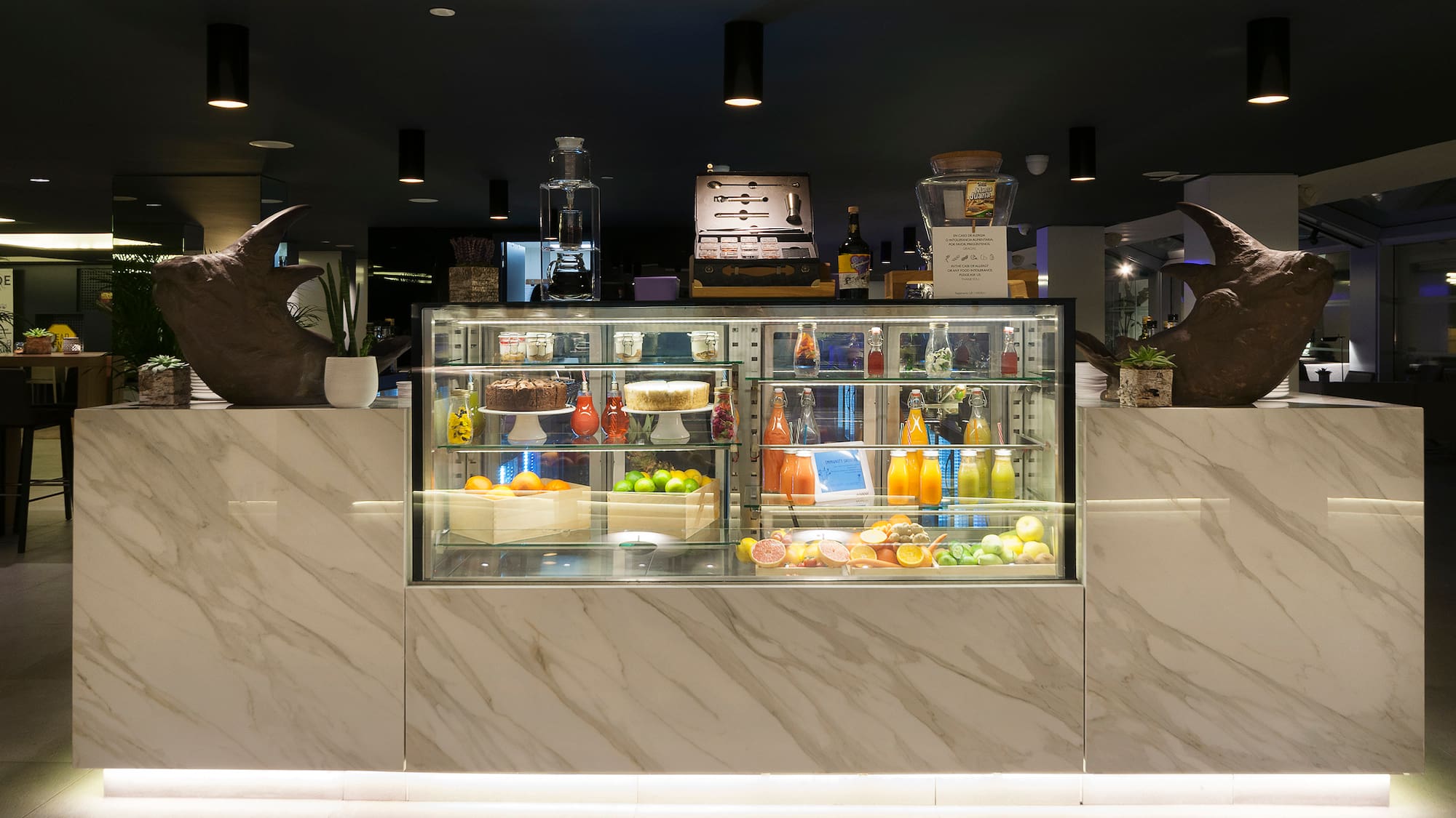 a display case with food and drinks on it