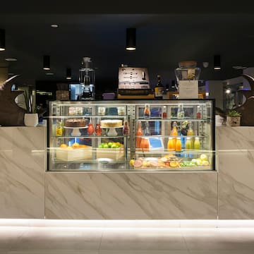a display case with food and drinks on it