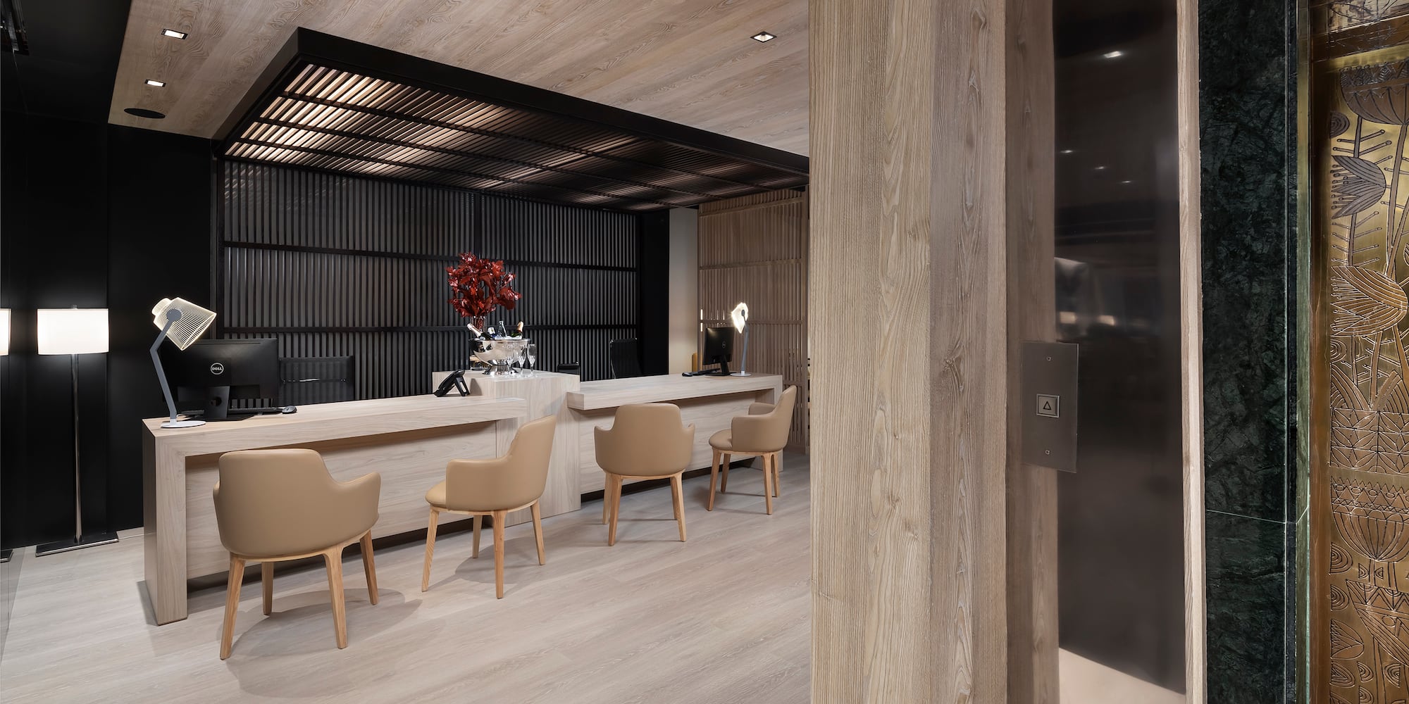 a room with a reception desk and chairs